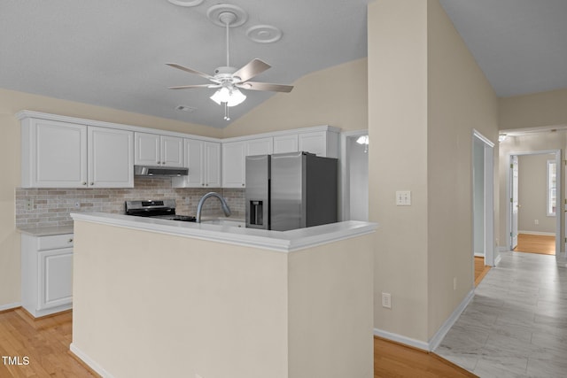 100 W Acres Cres, Cary, NC 27519 - kitchen with appliances with stainless steel finishes, exhaust hood, ceiling fan, tasteful backsplash, and lofted ceiling
