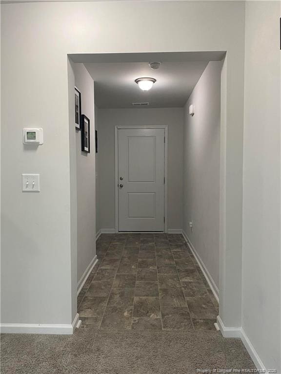 4671 Revelstroke Rd, Hope Mills, NC 28348 - hallway featuring baseboards and stone finish floors