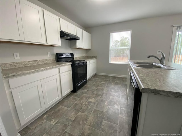4671 Revelstroke Rd, Hope Mills, NC 28348 - kitchen featuring black electric range, under cabinet range hood, white cabinetry, and healthy amount of natural light