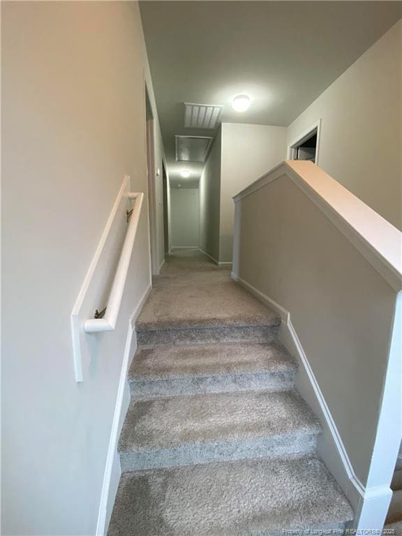 4671 Revelstroke Rd, Hope Mills, NC 28348 - stairway featuring carpet floors and baseboards