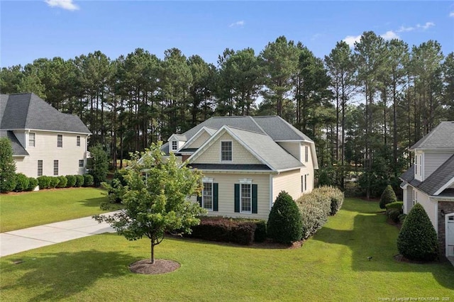 259 Rolling Pines Dr, Spring Lake, NC 28390 - view of front of property featuring a front yard and view of wooded area