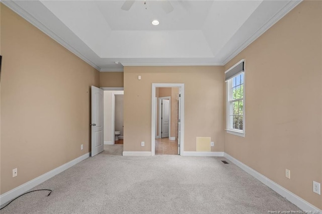 259 Rolling Pines Dr, Spring Lake, NC 28390 - unfurnished bedroom featuring a tray ceiling, light colored carpet, ornamental molding, and a ceiling fan