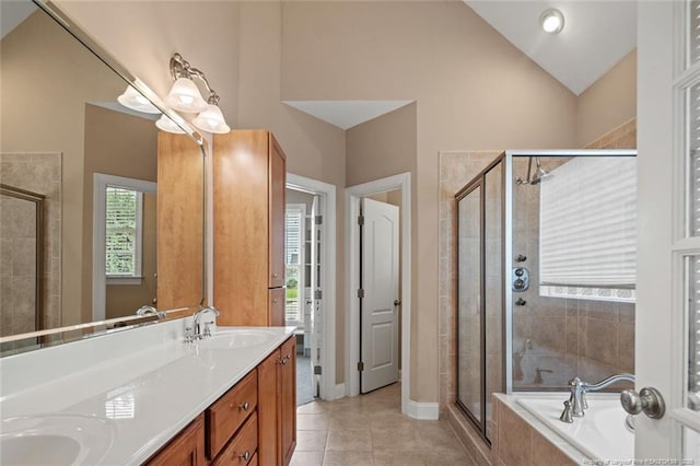 259 Rolling Pines Dr, Spring Lake, NC 28390 - full bathroom with lofted ceiling, a stall shower, a bath, double vanity, and tile patterned flooring