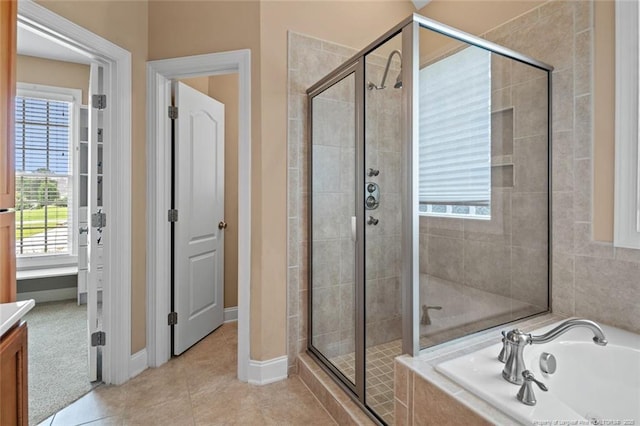 259 Rolling Pines Dr, Spring Lake, NC 28390 - full bath featuring a stall shower, a garden tub, vanity, and tile patterned floors