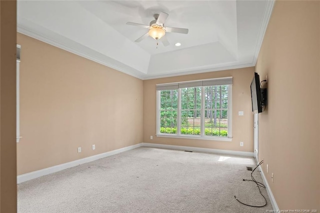 259 Rolling Pines Dr, Spring Lake, NC 28390 - empty room featuring a tray ceiling, a ceiling fan, carpet floors, and ornamental molding