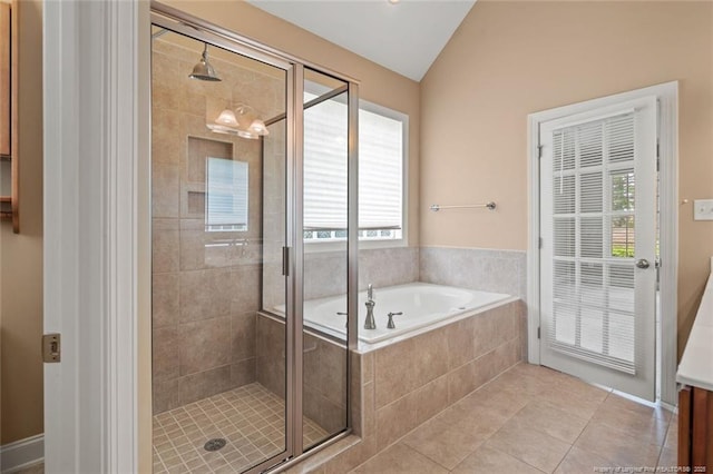 259 Rolling Pines Dr, Spring Lake, NC 28390 - full bath featuring a garden tub, a stall shower, tile patterned floors, lofted ceiling, and vanity