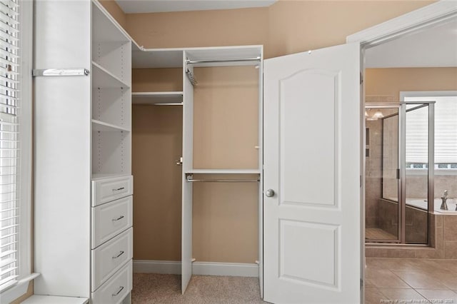 259 Rolling Pines Dr, Spring Lake, NC 28390 - walk in closet with light tile patterned flooring