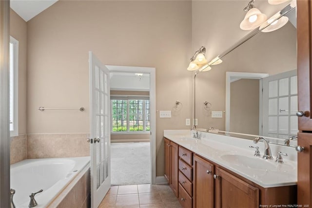 259 Rolling Pines Dr, Spring Lake, NC 28390 - full bath featuring tile patterned flooring, double vanity, and a garden tub