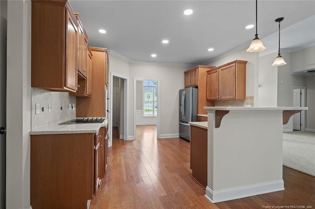 259 Rolling Pines Dr, Spring Lake, NC 28390 - kitchen featuring stainless steel fridge with ice dispenser, a kitchen breakfast bar, ornamental molding, light countertops, and a peninsula