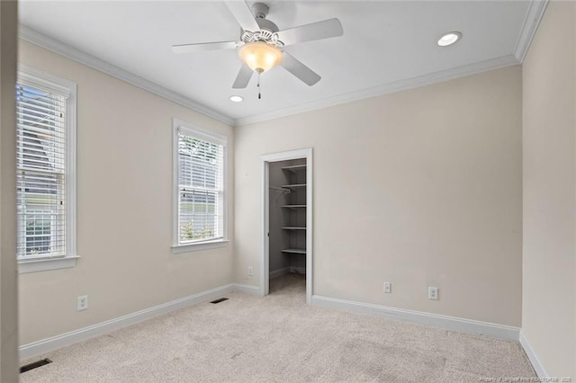 259 Rolling Pines Dr, Spring Lake, NC 28390 - unfurnished bedroom with carpet, crown molding, a spacious closet, recessed lighting, and ceiling fan
