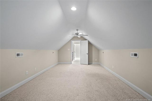 259 Rolling Pines Dr, Spring Lake, NC 28390 - additional living space with vaulted ceiling, a ceiling fan, and light colored carpet
