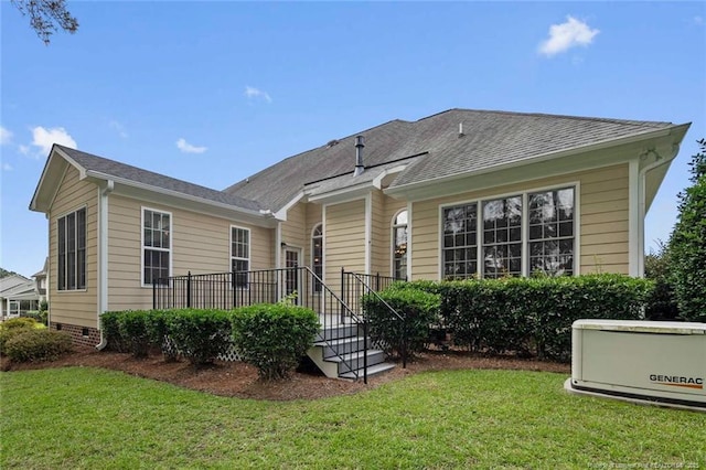 259 Rolling Pines Dr, Spring Lake, NC 28390 - back of property with a yard and roof with shingles
