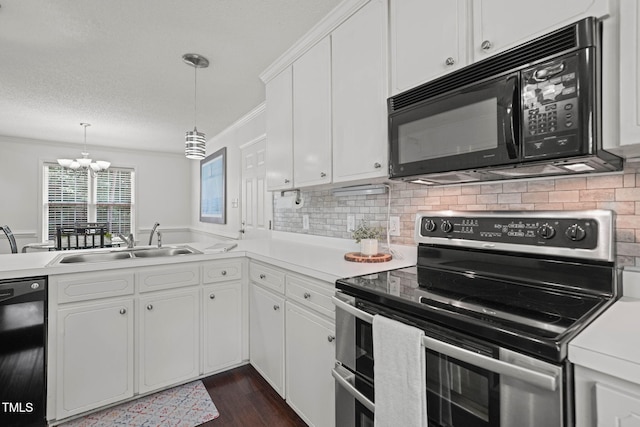 178 Palmer Dr, Clayton, NC 27527 - kitchen featuring black appliances, a chandelier, light countertops, crown molding, and decorative backsplash