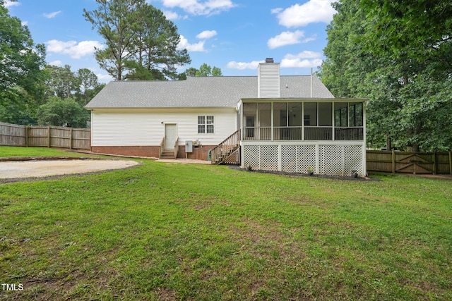 178 Palmer Dr, Clayton, NC 27527 - rear view of property with a sunroom, a chimney, and a fenced backyard