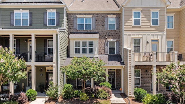 417 Austin View Blvd, Wake Forest, NC 27587 - townhome / multi-family property featuring brick siding, board and batten siding, a standing seam roof, and a metal roof