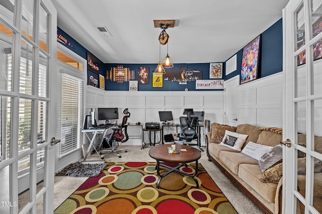 417 Austin View Blvd, Wake Forest, NC 27587 - carpeted living room with french doors, a decorative wall, and an office area