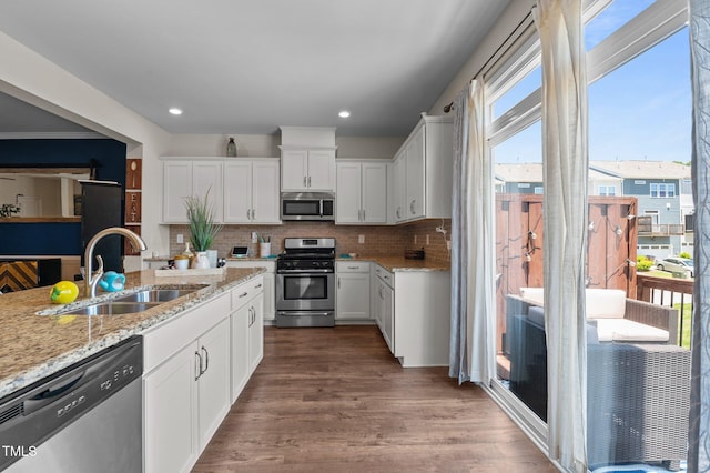 417 Austin View Blvd, Wake Forest, NC 27587 - kitchen with stainless steel appliances, decorative backsplash, white cabinets, dark wood-style floors, and recessed lighting