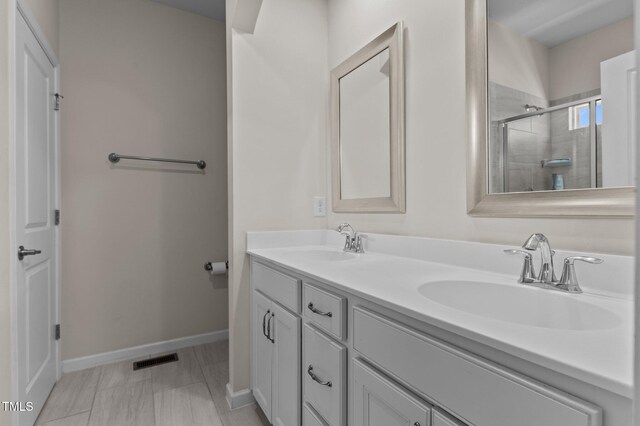 417 Austin View Blvd, Wake Forest, NC 27587 - bathroom with double vanity and a shower with shower door