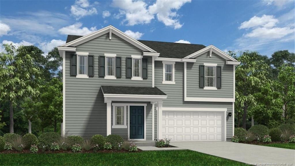 1048 Emerald Stone Loop, Hope Mills, NC 28348 - traditional-style house with driveway, a garage, and a shingled roof