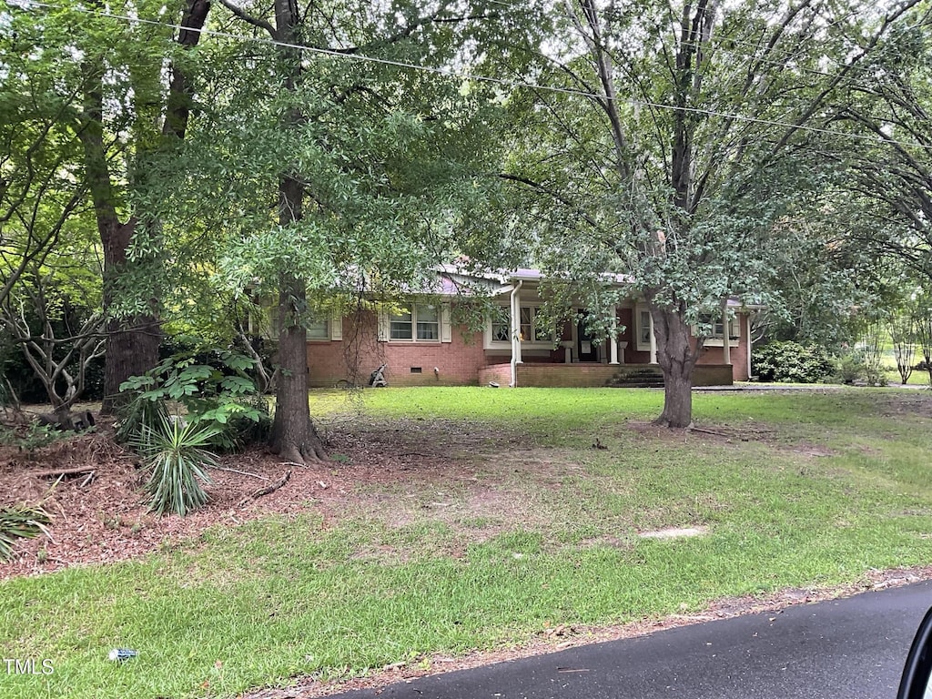 455 N Wiillow, Angier, NC 27501 - view of front of house featuring crawl space and a front yard