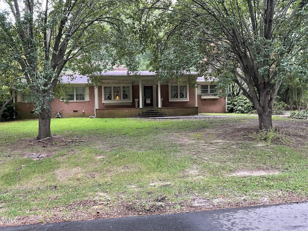 455 N Wiillow, Angier, NC 27501 - ranch-style home featuring crawl space, covered porch, a front yard, and brick siding
