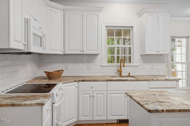 1120 Colonial Club Rd, Wake Forest, NC 27587 - kitchen featuring white appliances, ornamental molding, white cabinets, plenty of natural light, and backsplash