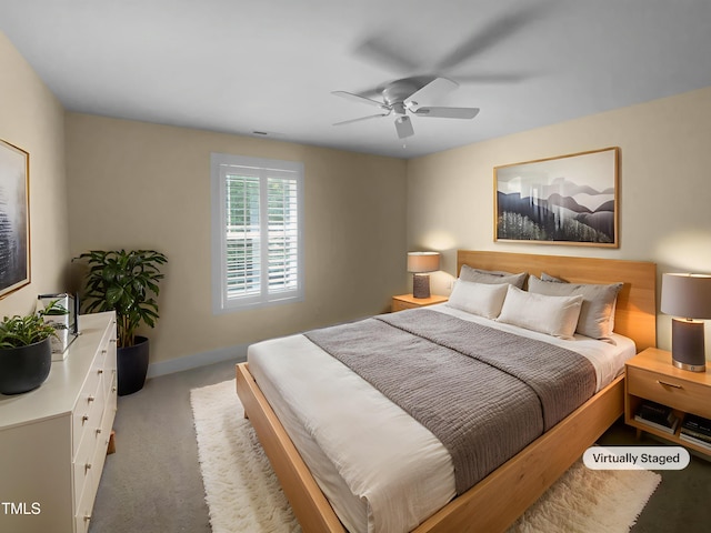 495 Ruth Cir, Fuquay Varina, NC 27526 - carpeted bedroom with a ceiling fan and baseboards