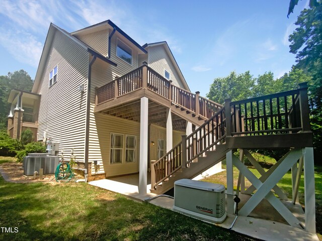 495 Ruth Cir, Fuquay Varina, NC 27526 - rear view of property with a wooden deck, a patio, and a yard