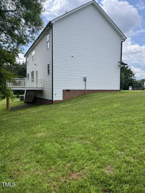 3204 Overlook Ct, Burlington, NC 27215 - view of side of property with crawl space, a wooden deck, and a lawn
