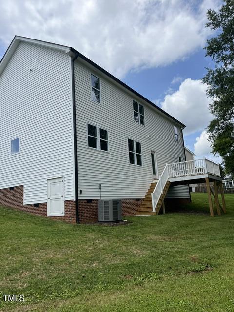 3204 Overlook Ct, Burlington, NC 27215 - rear view of house featuring crawl space, stairway, and a yard