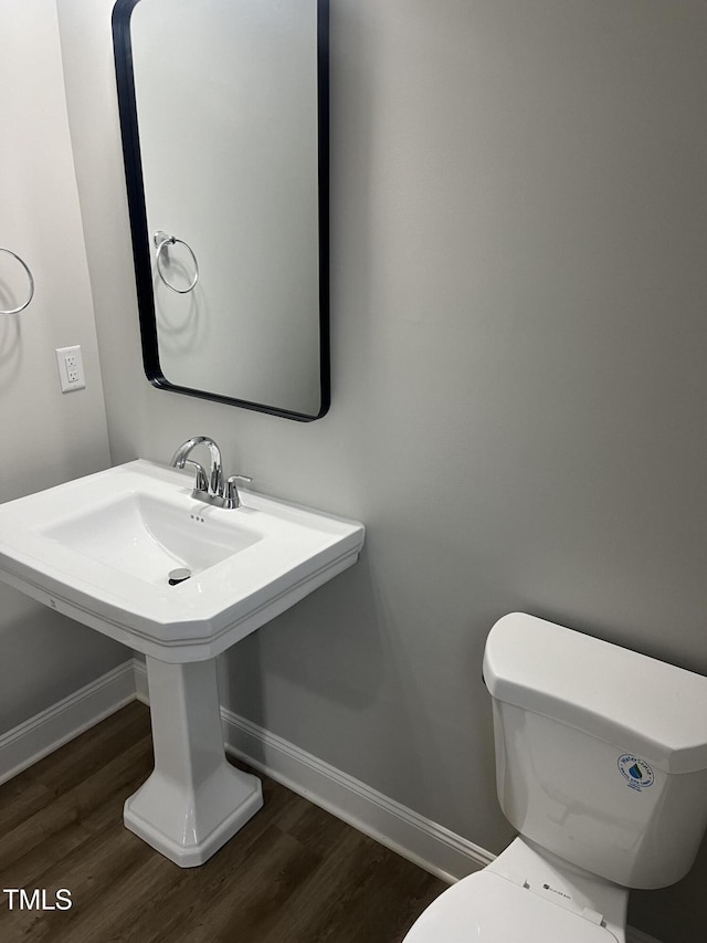 3204 Overlook Ct, Burlington, NC 27215 - half bathroom with baseboards and wood finished floors