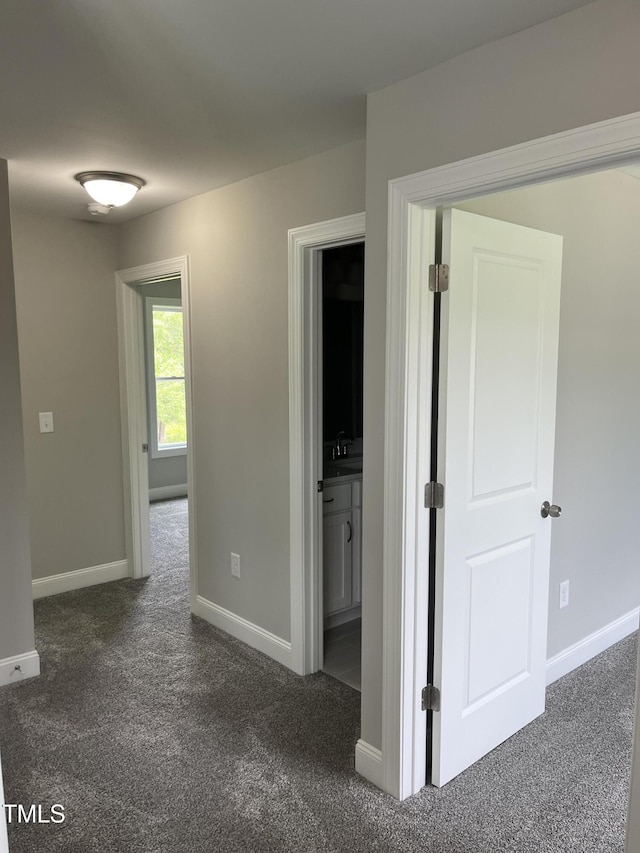 3204 Overlook Ct, Burlington, NC 27215 - hall featuring dark colored carpet and baseboards