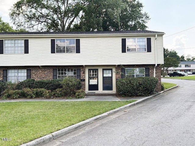 1002 Willow Dr Unit 63, Chapel Hill, NC 27514 - view of front facade featuring a front yard and brick siding