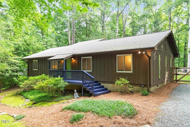 1403 Meadow Ln, Chapel Hill, NC 27516 - view of front of property with a shingled roof, board and batten siding, a porch, and crawl space