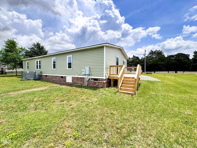 6283 US-258, Tarboro, NC 27886 - back of house with a wooden deck, a yard, and crawl space