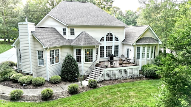 5920 Two Pines Trl, Wake Forest, NC 27587 - back of property featuring a deck, a yard, a chimney, and a shingled roof