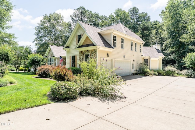 5920 Two Pines Trl, Wake Forest, NC 27587 - view of front of home featuring an attached garage, concrete driveway, a shingled roof, and a front yard