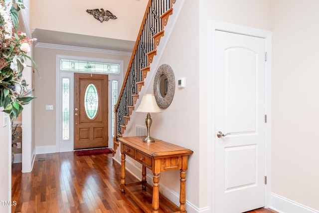 5920 Two Pines Trl, Wake Forest, NC 27587 - foyer with wood finished floors, stairs, and ornamental molding