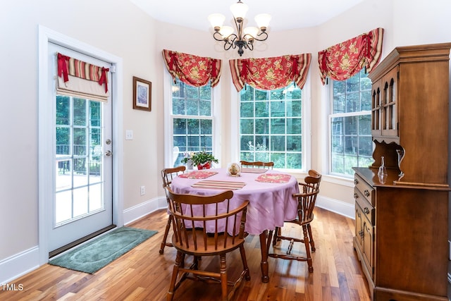 5920 Two Pines Trl, Wake Forest, NC 27587 - dining space with light wood-style floors and a chandelier