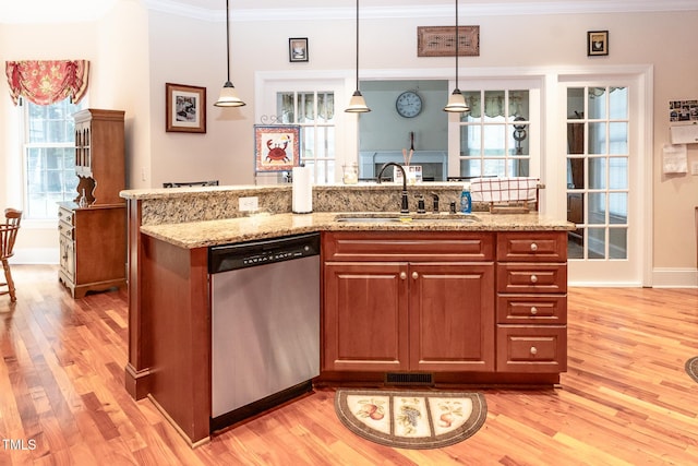 5920 Two Pines Trl, Wake Forest, NC 27587 - kitchen with dishwasher, light wood finished floors, ornamental molding, and hanging light fixtures