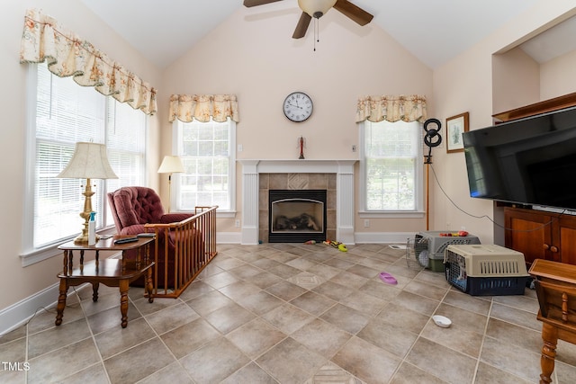 5920 Two Pines Trl, Wake Forest, NC 27587 - living area with vaulted ceiling, ceiling fan, tile patterned flooring, and a tile fireplace