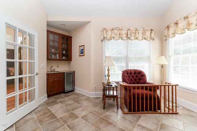5920 Two Pines Trl, Wake Forest, NC 27587 - sitting room with beverage cooler, wet bar, and light tile patterned floors