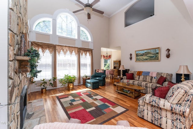 5920 Two Pines Trl, Wake Forest, NC 27587 - living area featuring hardwood / wood-style floors, a ceiling fan, crown molding, and a high ceiling