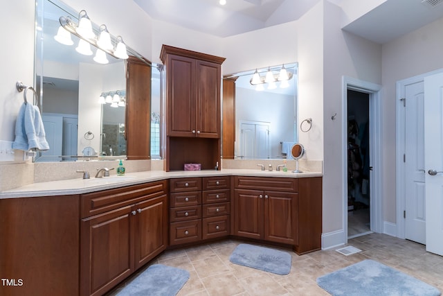 5920 Two Pines Trl, Wake Forest, NC 27587 - full bath featuring double vanity, a spacious closet, and tile patterned floors