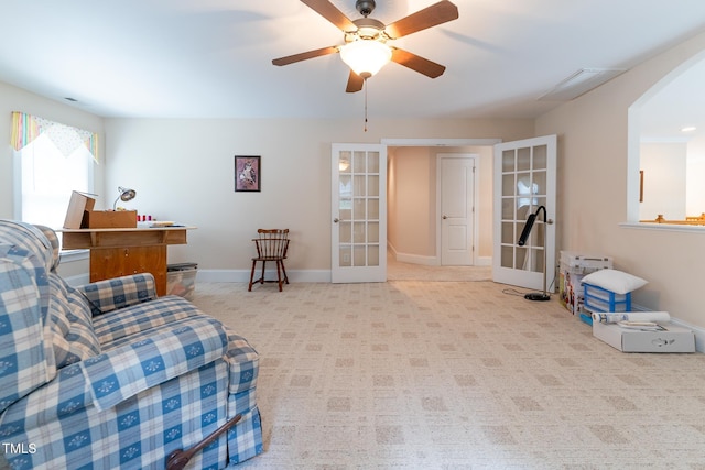 5920 Two Pines Trl, Wake Forest, NC 27587 - carpeted living area with french doors, arched walkways, and a ceiling fan
