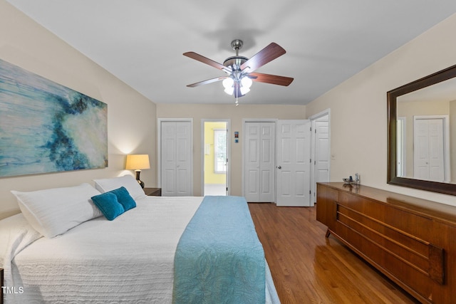 308 Trappers Sack Rd, Cary, NC 27513 - bedroom with two closets, wood finished floors, and a ceiling fan