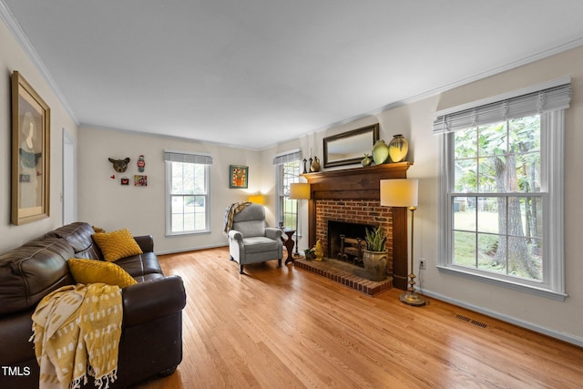 308 Trappers Sack Rd, Cary, NC 27513 - living room featuring crown molding, wood finished floors, and a fireplace