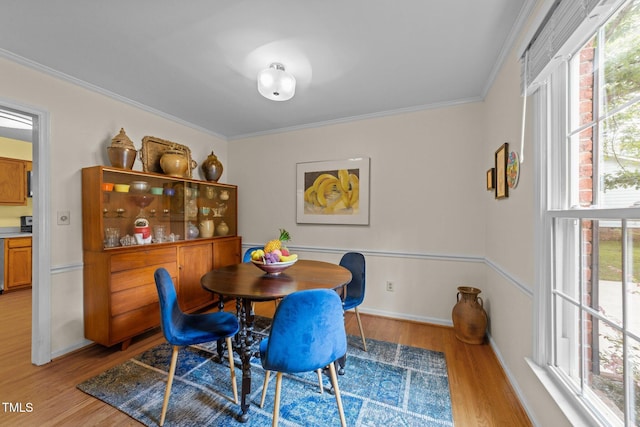 308 Trappers Sack Rd, Cary, NC 27513 - dining space with light wood-style floors, crown molding, and plenty of natural light