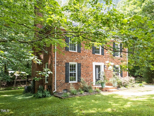 308 Trappers Sack Rd, Cary, NC 27513 - view of front of house with a front yard and brick siding