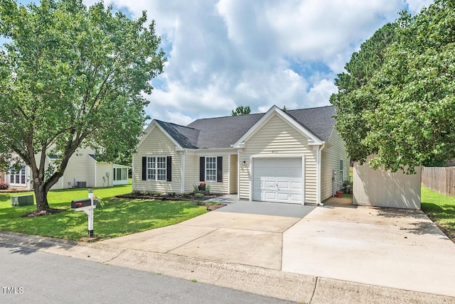 611 Quartz Dr, Durham, NC 27703 - view of front of home featuring an attached garage, driveway, and a shingled roof